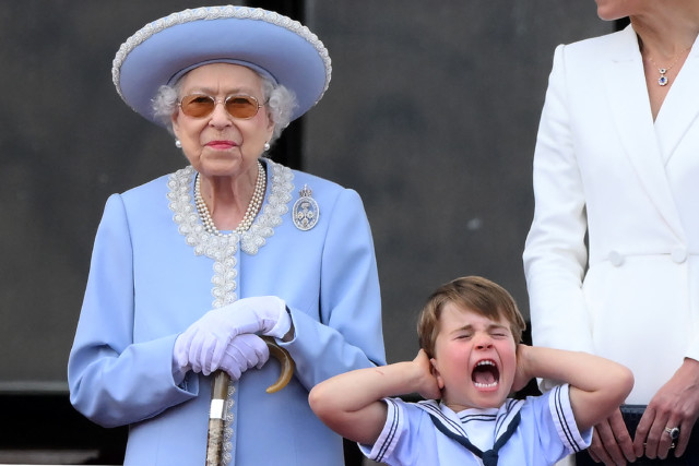 While the monarch was seen smiling during the flypast, Prince Louis wasn't quite so sure