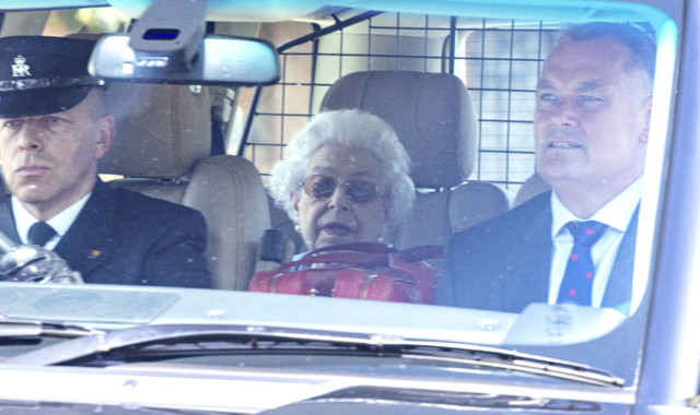 Her Majesty covered her eyes with shades as she was driven away from the city centre after the event 